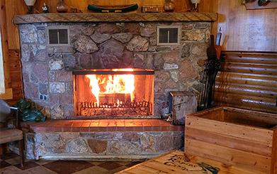 Frog Rapids Camp cozy fireplace on a cold day